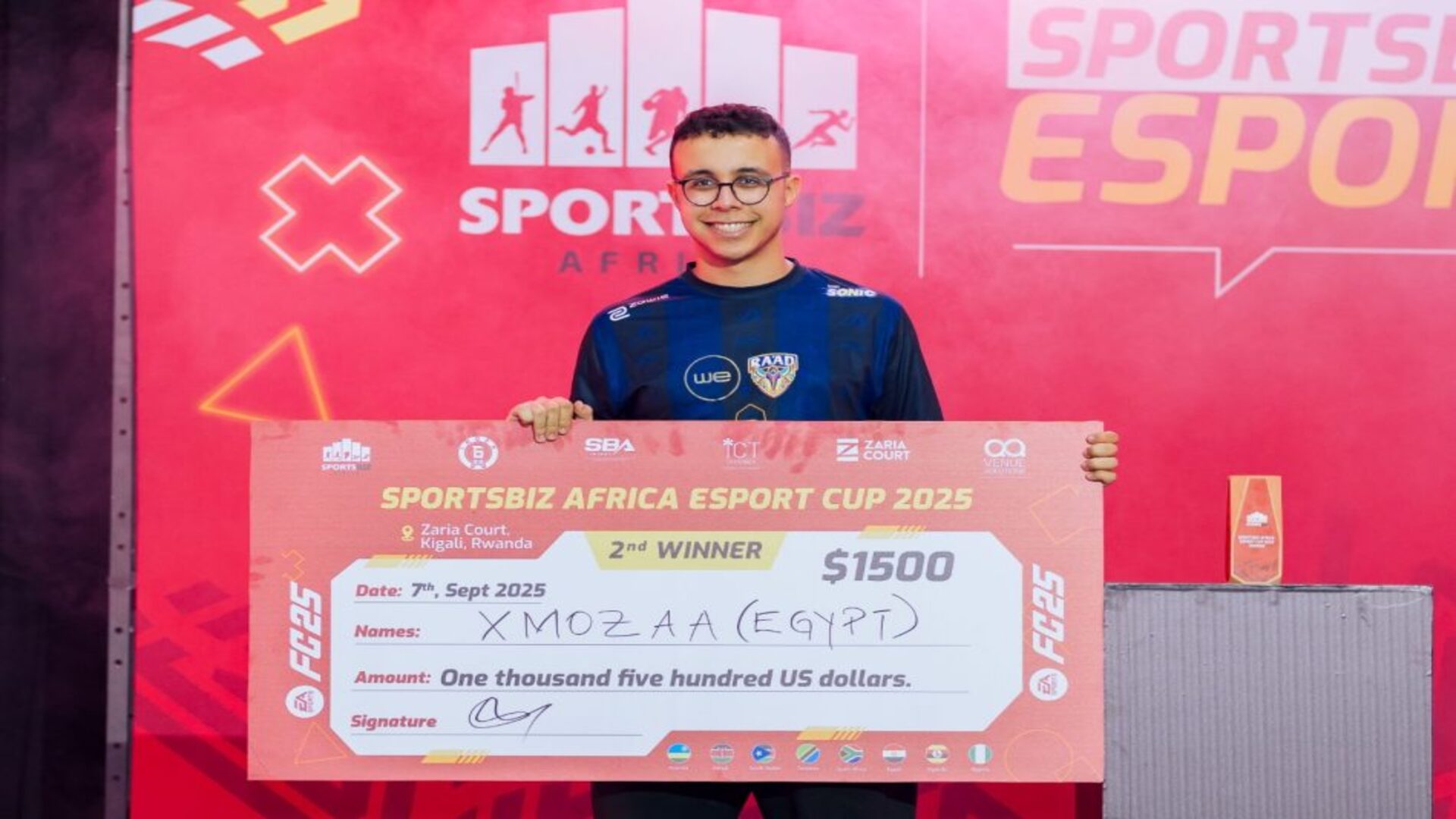 Xmozaa with SportsBiz cheque